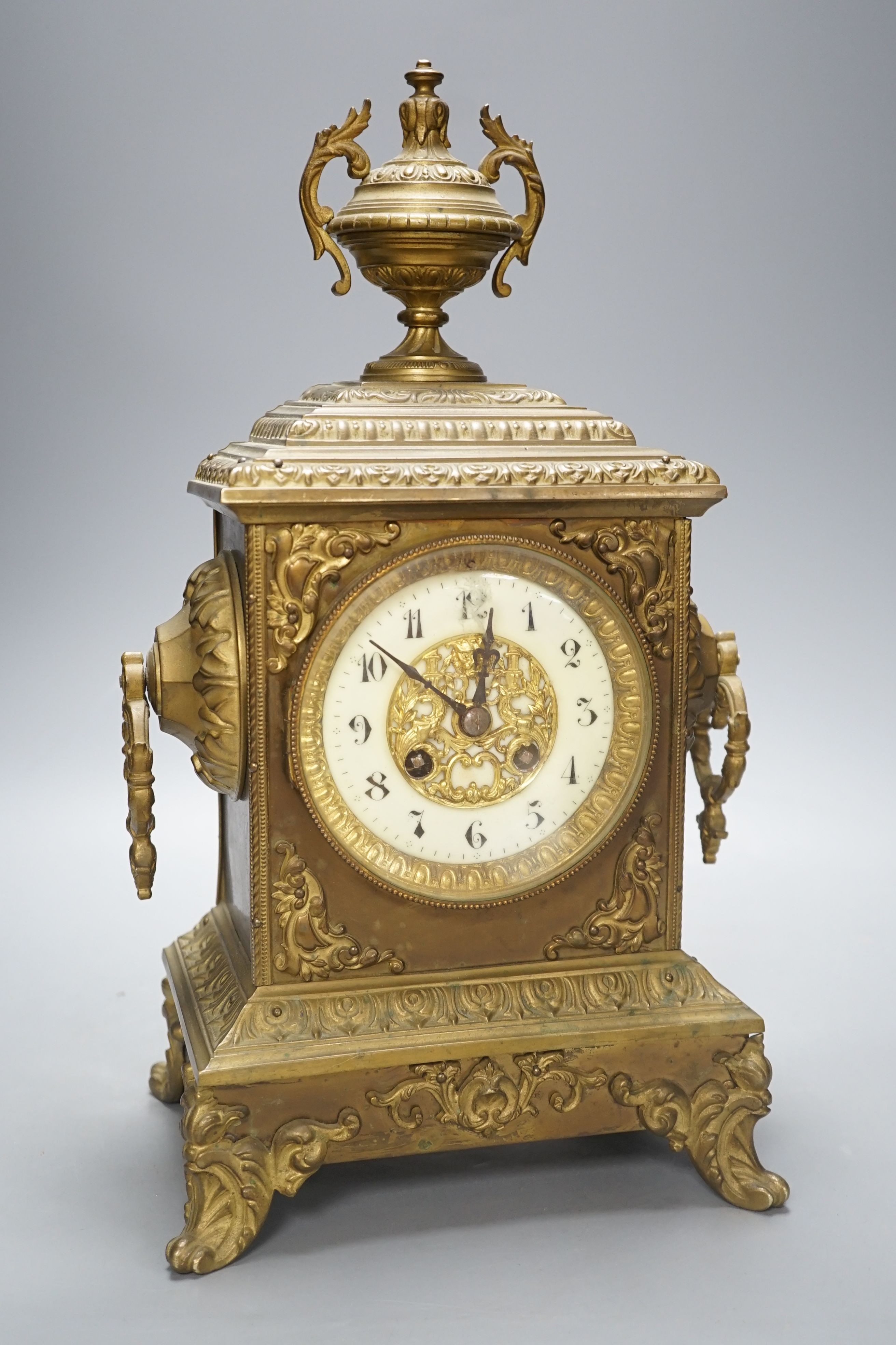 An early 20th century brass mantel clock, 40 cms high.
